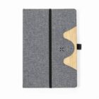Gray notebook with black elastic band and a wooden accent on the right edge.