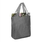 Gray tote bag with magazine and water bottle peeking out of the top.
