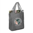 Gray tote with Sage Philosophy logo, holding magazines and a silver water bottle.
