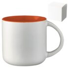 White ceramic mug with a bright orange interior and a curved handle, positioned next to a plain white box.