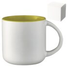 A white ceramic mug with a yellow interior and a rounded handle. A plain white cube-shaped box is positioned in the upper right corner of the image.