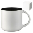 White ceramic mug with a black interior and a large handle, shown next to a plain white box.