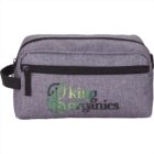 Gray toiletry bag with King Organics logo in green and black.