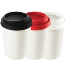 Three white reusable cups with black, red, and white lids, side by side on a white background.