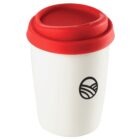 White travel mug with a red lid and a black circular logo on the front.