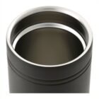 Close-up of an open stainless steel travel mug with a dark beverage inside. The mug has a sleek design with a smooth rim and a glossy finish, partially reflecting light. The interior appears insulated.