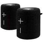 Two portable black Bluetooth speakers with a cylindrical design. Each speaker features a large plus and minus button on the front side, indicating volume control, and a textured exterior for grip.