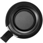 Close-up of a black circular speaker with a fabric mesh cover and a looped handle. The speaker features a sleek, minimalist design, highlighting the central grille and sturdy construction.