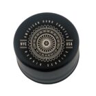 A round black container lid with the text American Hand Crafted Repair Service encircling a decorative bicycle wheel design. The words NYC and USA are on either side. The center reads Workshop.