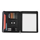 Open black portfolio organizer displaying a notepad on the right and on the left, sections for a USB drive, pens, sticky notes in various colors, and a folder. The organizer is neatly arranged on a white background.