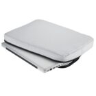 A silver laptop partially slides out of a light gray, padded sleeve. The sleeve is slightly open, revealing the laptops edge and ports. The background is plain white.