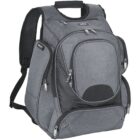A gray backpack with multiple zippered compartments, padded shoulder straps, and a handle on top. The fabric appears durable, with black accents and silver zippers. The front has a curved design with a smaller pocket.