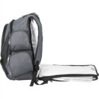 A gray backpack with multiple zippered compartments is open, showing a laptop partially pulled out from a dedicated pocket. The main compartment flap is fully extended, revealing a white interior.