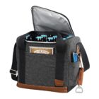 A gray insulated cooler bag with brown accents is shown open, revealing several bottles with blue caps inside. The bag has black straps, a side pocket with a blue item, and a bottle opener attached to a leather strap on the side.