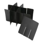 Black, interlocking, plastic folder organizer with multiple slots, disassembled into separate panels against a white background.