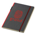 A gray hardcover notebook with red edges and an elastic band. The cover features the word grond in red with a circular design of letters above it.