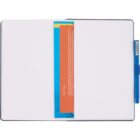 An open notebook with blank pages lies flat. A blue pen is clipped to the right-hand page. In the center, a blue and orange booklet or flyer is partially visible, inserted between the pages. The background is plain white.