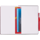 Open notebook with a red pen clipped to the right side. Inside, a colorful insert with text is visible, partially tucked into the pages, displaying phrases about entertainment and pricing. The notebook has blank white pages.