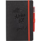 Black notebook with the embossed text hello Aloha ice goodbye and a popsicle design. It has a red elastic band and an attached red pen holder with a pen on the side.