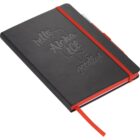 A black notebook with embossed words hello, Aloha, Ice, and goodbye on the cover. It has a red elastic band and a red ribbon bookmark. The page edges are red, and theres a tab visible at the top.