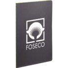 A black notebook with the Foseco logo on the cover. The logo features a stylized white circle with a spiky pattern and the word FOSECO in bold lettering underneath. The notebook is standing upright against a white background.