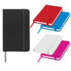 A collection of five hardcover notebooks with elastic bands in different colors: black, red, blue, white, and pink. They are displayed in pairs, except for the black one, which stands alone. Each notebook has a matching ribbon bookmark.