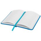 An open notebook with lined pages, featuring a blue cover and a blue ribbon bookmark placed between the pages. The notebook is laying flat and the lines on the pages are clearly visible.