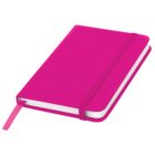 A closed, bright pink notebook with a matching elastic band and ribbon bookmark. The notebook has a smooth cover and appears to be slightly open, showing white pages inside.
