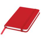 A red hardcover notebook with a matching elastic band and ribbon bookmark. It is lying closed on a flat surface, showing its white pages on the side.