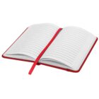 An open red notebook with lined pages, featuring a matching red ribbon bookmark placed in the center.