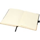 An open notebook with blank, cream-colored pages and a black ribbon bookmark. The cover appears to be tan, and the notebook is laying flat on a white surface.