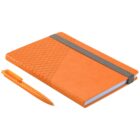An orange notebook with a gray elastic closure and a textured triangular pattern on the cover is next to an orange pen. The pen has a similar textured design near the tip.
