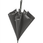 A black reverse umbrella with a C-shaped handle, shown in a half-open position, highlighting its unique folding design.