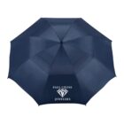 A navy blue umbrella with the text Paul Gross Jewelers and a diamond logo printed in white on one of the panels. The umbrella is fully opened, showcasing its eight-panel design.