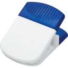 A white plastic clip with a blue, ridged rubber grip at the top, designed for securing papers or bags. The clip is slightly open, showcasing its functionality.