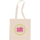 A beige tote bag with two handles features the word safe in large pink letters. Below it, in smaller text, it says see. act. fix. everyday. The design is encircled by a green ring.