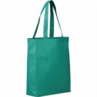 A teal reusable tote bag with two handles is standing upright. The bag is plain, without any designs or logos, and is set against a white background.