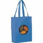 Blue tote bag with long handles and a circular design on the front that includes three stylized leaves in orange, green, and brown.