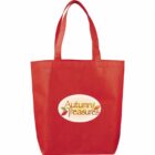 A red tote bag with two handles, featuring an oval logo reading Autumn Treasures in brown text, accompanied by colorful leaf illustrations around the text.