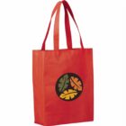 Red tote bag with two handles and a circular design featuring green, orange, and yellow leaves on the front.