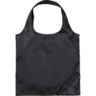 A simple black reusable shopping bag with a wide strap is folded neatly. The bag has a smooth texture and appears lightweight.