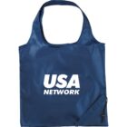 Blue reusable bag with USA NETWORK in white text on the front. The bag has a square shape with a handle and a small pouch attached at the bottom right corner.