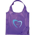 Purple reusable bag with a light blue stylized heart and the letters MCS in the center. The bag has a handle and a side pouch with a drawstring.