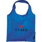 A blue reusable tote bag with the word TAMU printed in black and a small red emblem above it. The bag features a side pocket with a drawstring closure.