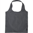A dark gray reusable tote bag with a wide handle, featuring a small pocket near the bottom corner with a zipper. The bag is laid flat on a white background.