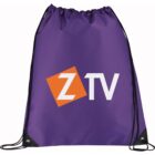 Purple drawstring bag with a logo featuring a tilted orange square overlapping a white Z, followed by TV in white letters. Black drawstrings run from the top corners to the bottom eyelets.