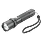 Black handheld flashlight with a wrist strap, angled to the right on a white background.