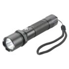 Black handheld flashlight with wrist strap, shown at an angle on a white background.