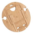 Round wooden wine table with built-in slots for holding wine glasses and a central area for a bottle. It has a foldable stand on the underside for easy setup and transport.
