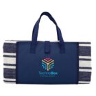 A folded navy blue and white striped picnic blanket with handles and the TechnoBox Hosting Service logo on the front, featuring a colorful abstract design above the text.